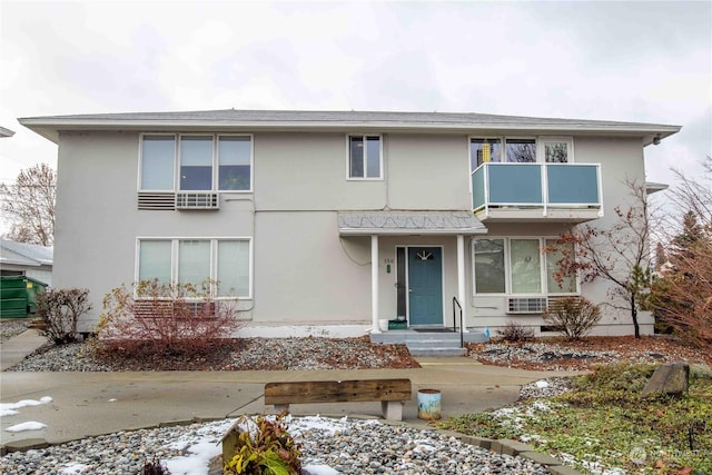 view of front of property with a balcony