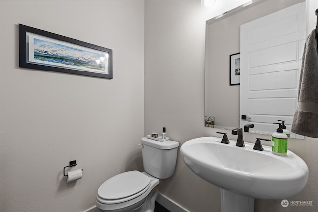 bathroom featuring sink and toilet