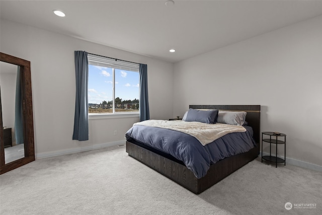 bedroom with light colored carpet