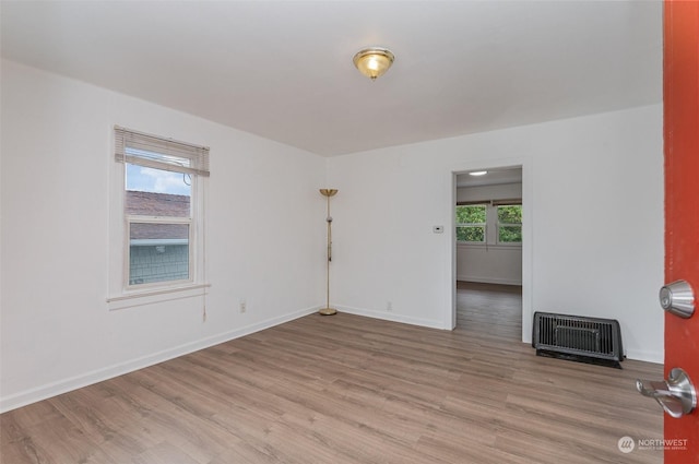 spare room with light hardwood / wood-style flooring