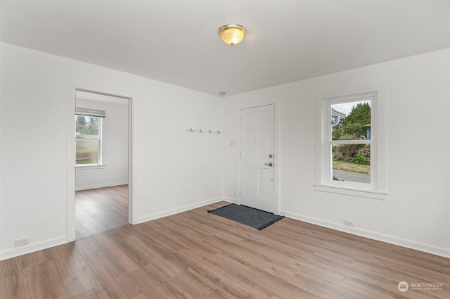 unfurnished room featuring light wood-type flooring