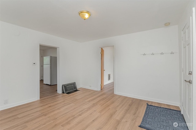 unfurnished room featuring light wood-type flooring