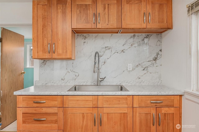 kitchen featuring sink and backsplash