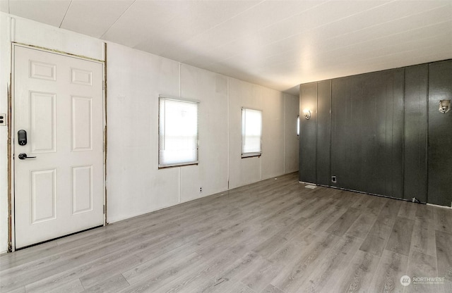 spare room featuring light hardwood / wood-style floors