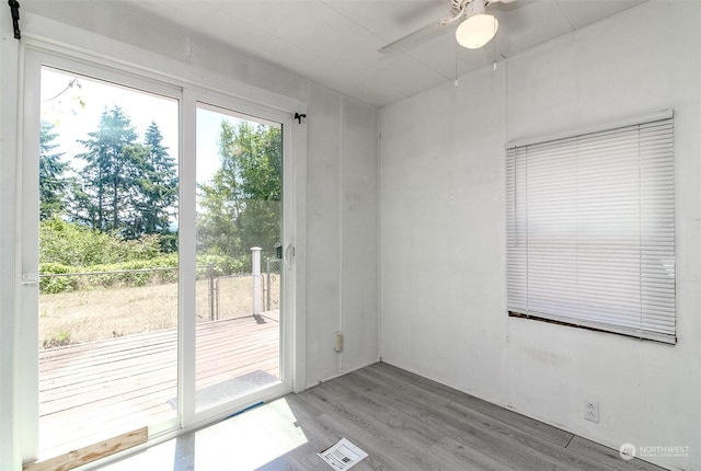 entryway with ceiling fan and light hardwood / wood-style floors