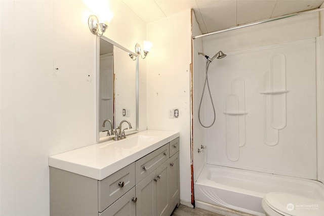 full bathroom with vanity, bathtub / shower combination, and toilet