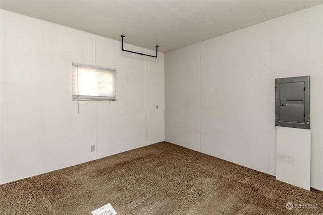 unfurnished room featuring carpet flooring and electric panel