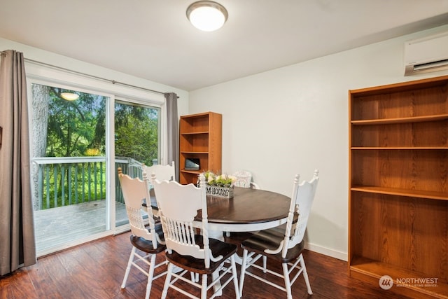 dining area with a wall unit AC and dark wood-type flooring