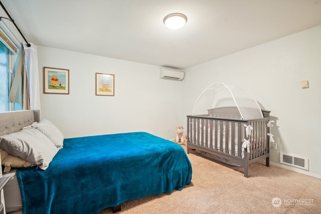 carpeted bedroom with a wall mounted AC