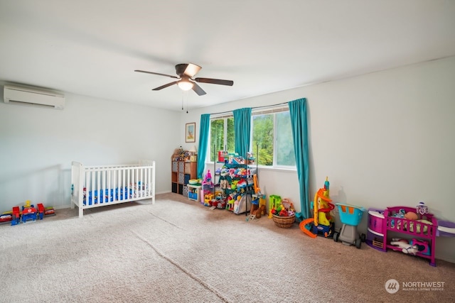 bedroom featuring an AC wall unit, ceiling fan, carpet flooring, and a crib