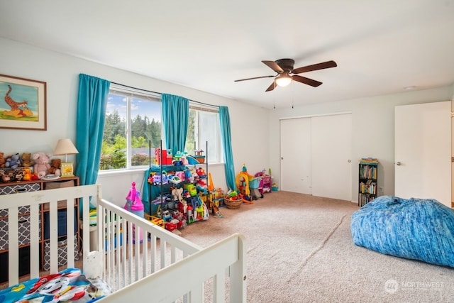 bedroom featuring ceiling fan, carpet floors, and a closet