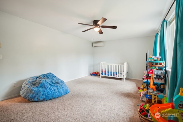 carpeted bedroom with a wall mounted air conditioner and ceiling fan