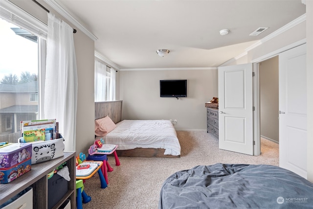 carpeted bedroom with ornamental molding