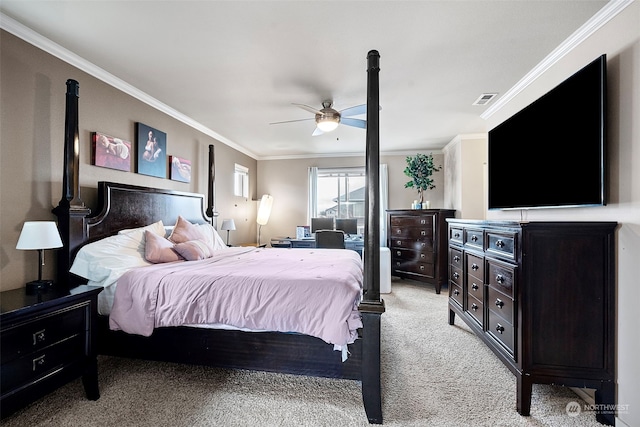 bedroom with ceiling fan, crown molding, and light colored carpet