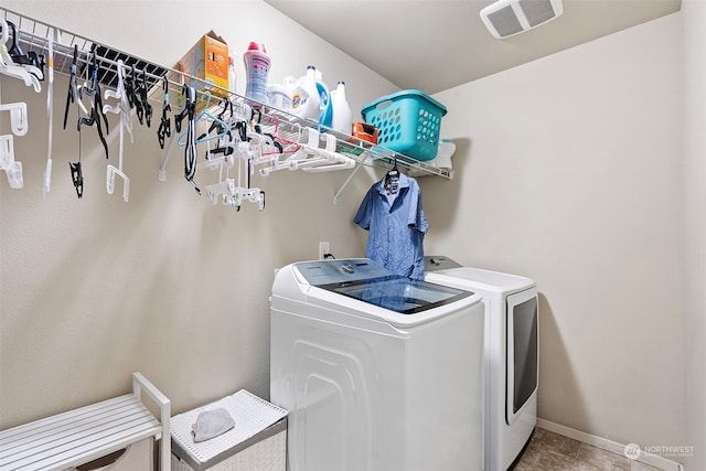 laundry room with washing machine and clothes dryer