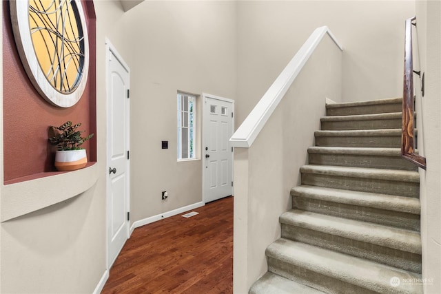 entryway with dark hardwood / wood-style floors