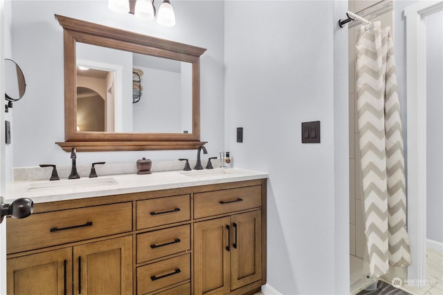 bathroom featuring a shower with shower curtain and vanity