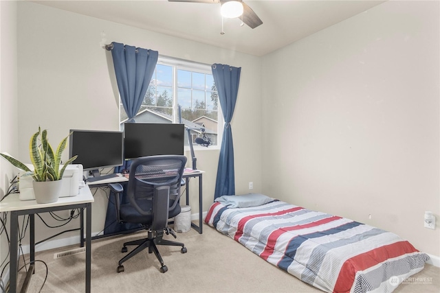 carpeted bedroom with ceiling fan