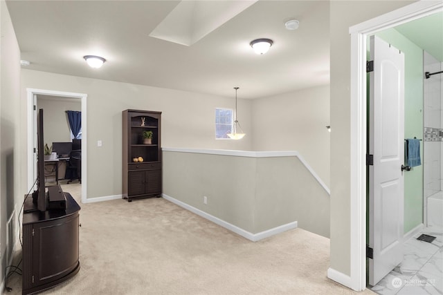 hallway with light colored carpet