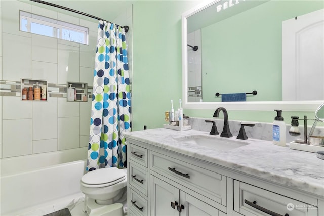 full bathroom featuring shower / bath combination with curtain, toilet, and vanity