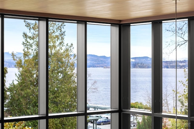 interior space featuring a water and mountain view