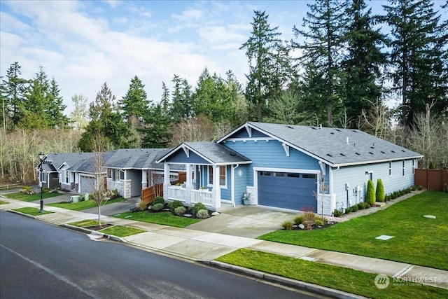 view of front of home featuring a front yard and a garage