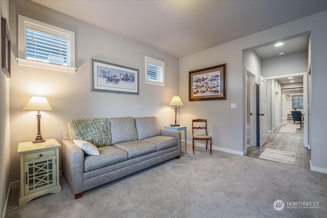 living room featuring light colored carpet