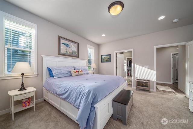 bedroom featuring light colored carpet