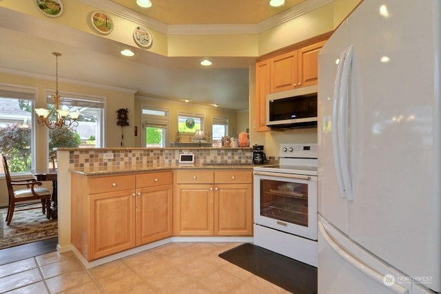 kitchen featuring pendant lighting, white appliances, decorative backsplash, light stone countertops, and a chandelier