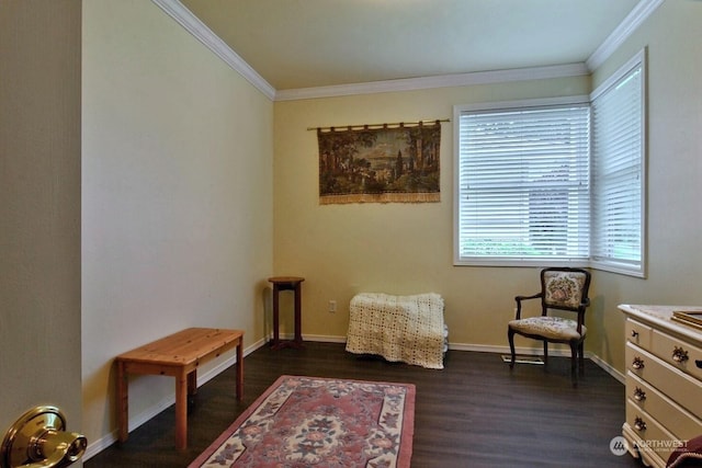 sitting room with a healthy amount of sunlight, dark hardwood / wood-style flooring, and crown molding