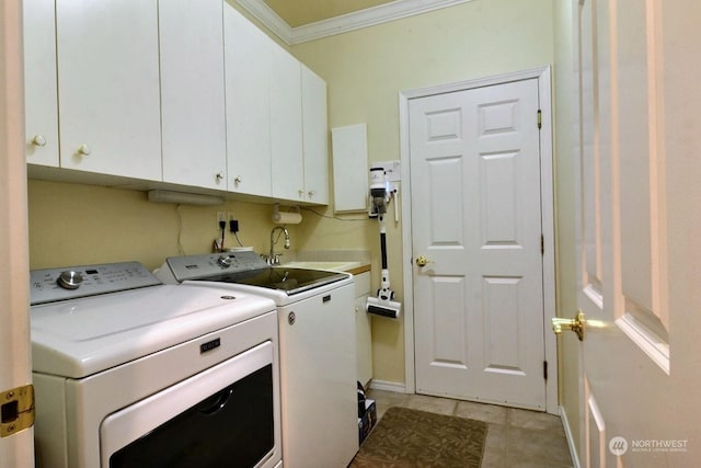 washroom featuring sink, cabinets, independent washer and dryer, light tile patterned floors, and ornamental molding