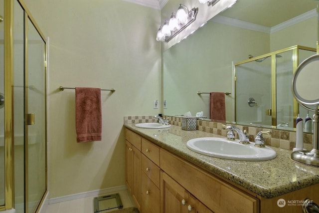 bathroom featuring vanity, an enclosed shower, and crown molding