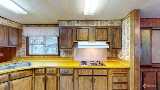 kitchen featuring white gas cooktop and sink