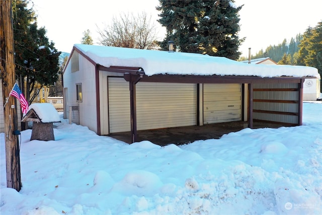 view of snow covered garage