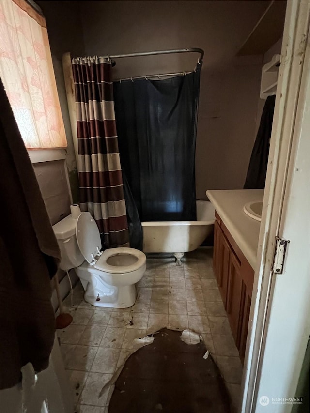 full bathroom with shower / tub combo, vanity, and toilet