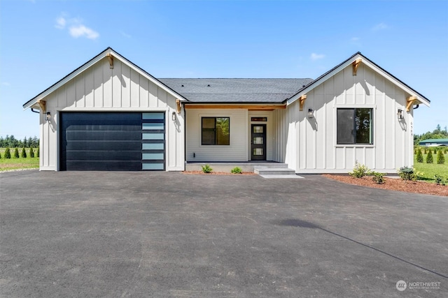 modern farmhouse style home with a garage