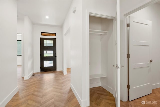 foyer with light parquet flooring