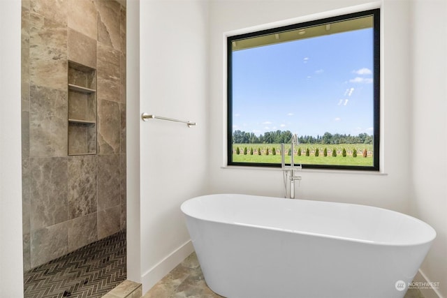 bathroom featuring separate shower and tub