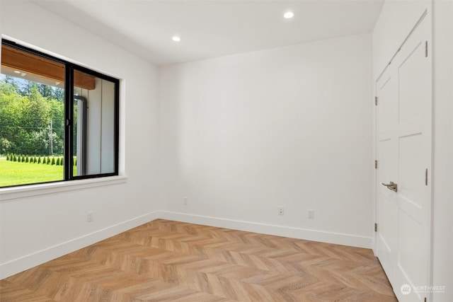 empty room with light parquet flooring