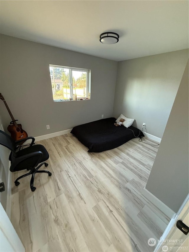 bedroom with light hardwood / wood-style floors