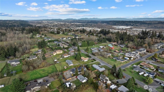 drone / aerial view featuring a mountain view