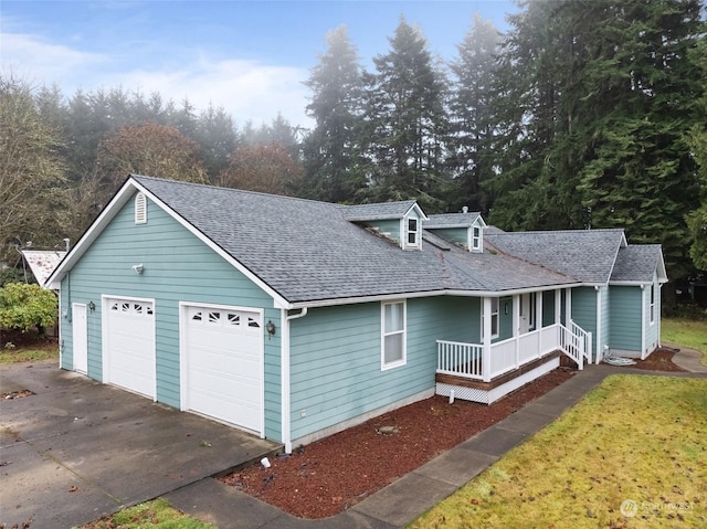 view of front of property featuring a porch and a garage