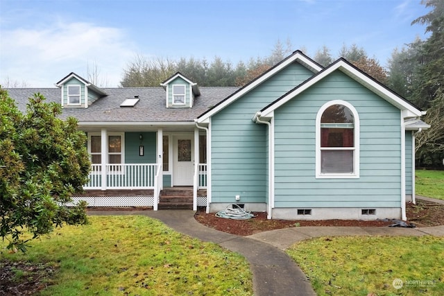 cape cod house with covered porch and a front lawn