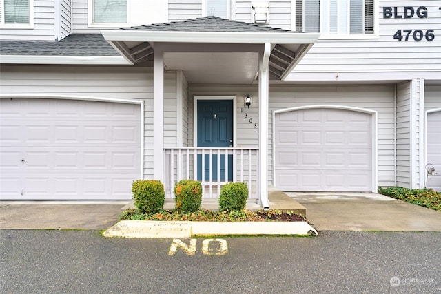 property entrance with a garage