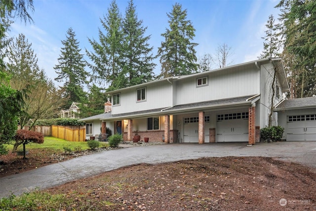 front facade with a porch and a garage