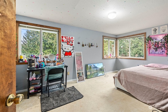 carpeted bedroom featuring a textured ceiling