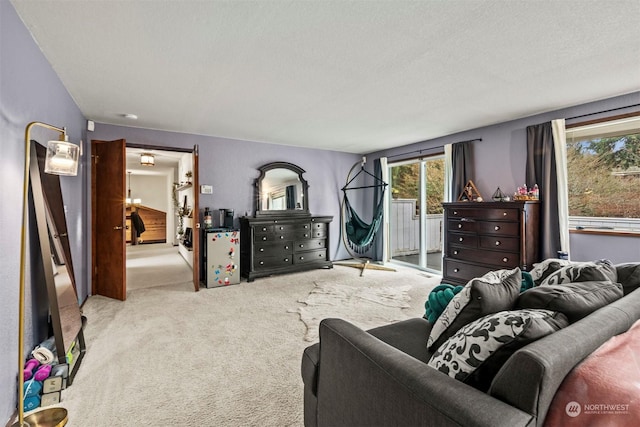 living room with a textured ceiling and light carpet