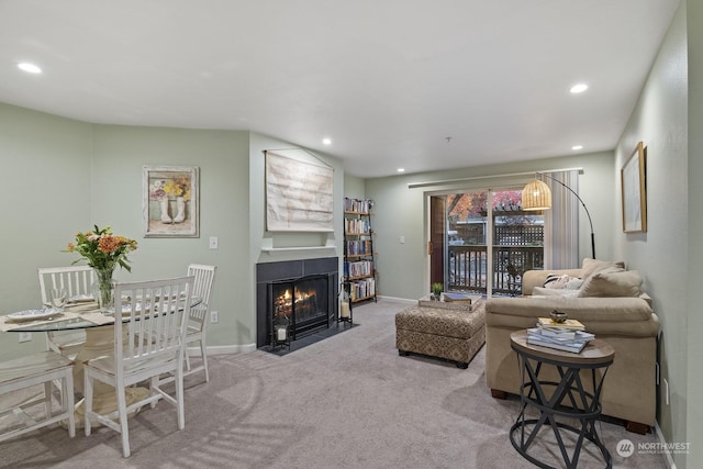 carpeted living room with a fireplace