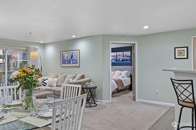 view of carpeted dining area