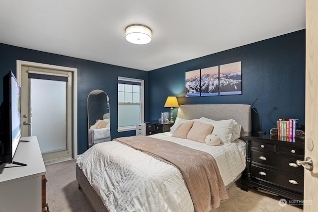 bedroom featuring light carpet